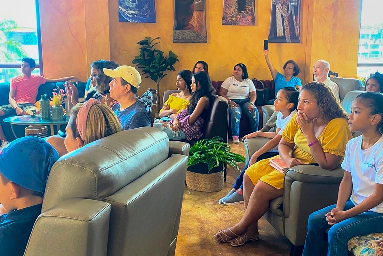 An enraptured multicultural audience listens to Pastor Janice's service at Upper Room Church.